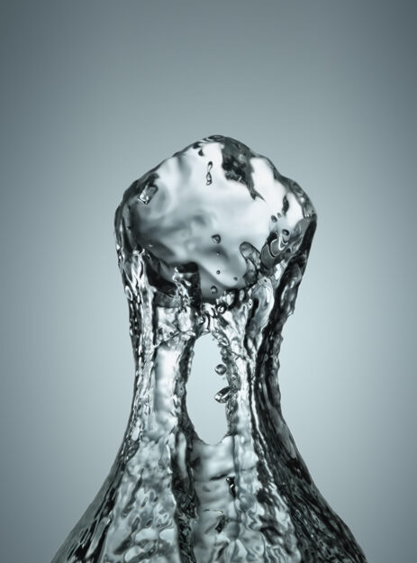 Ice cube dropped into water